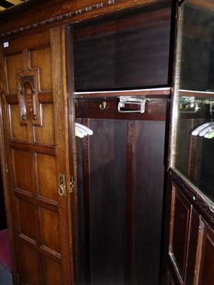 Lot 1438 - An early 20th century carved oak Jacobean style double-door wardrobe