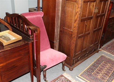 Lot 1439 - A four-piece Edwardian mahogany bedroom suite, comprising a dressing table, wardrobe, chest of...