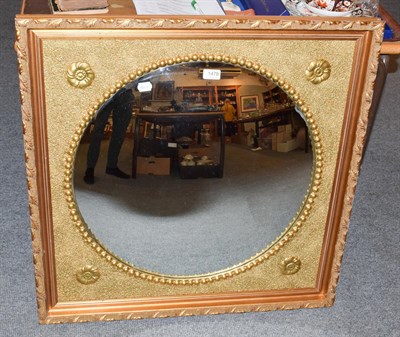 Lot 1478 - A giltwood framed convex wall mirror, 61cm diameter