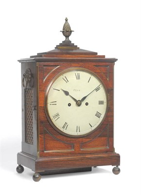 Lot 1195 - A Regency Rosewood Striking Table Clock, surmounted by a pineapple finial, side carrying...