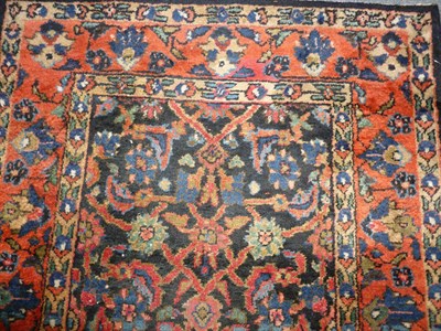 Lot 1230 - Hamadan Runner West Persia The midnight blue field of Herati design enclosed by burnt orange...