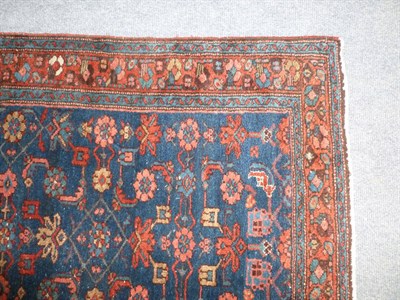 Lot 1232 - Hamadan Runner West Persia The indigo field of Herati design enclosed by brick red borders of...