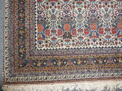 Lot 1236 - A Zil-i-Sultan Rug South Persia The cream field with columns of urns of flowers,enclosed by...