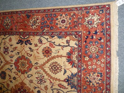 Lot 1241 - Pakistan Wool Runner The fawn field worked with rows of stylised flowerheads within a palmette...