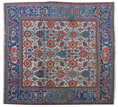 Lot 1242 - Feraghan Wool Carpet West Persia The ivory field filled with rows of stylised medallions within...