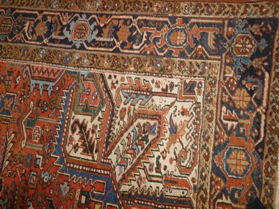 Lot 1246 - Heriz Carpet Persian Azerbaijan The terracotta field of polychrome angular vines centred by an...