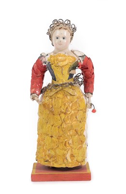 Lot 6007 - Another Similar Late 19th Century Carved Polychrome Doll, with jointed bent arms, blue painted...
