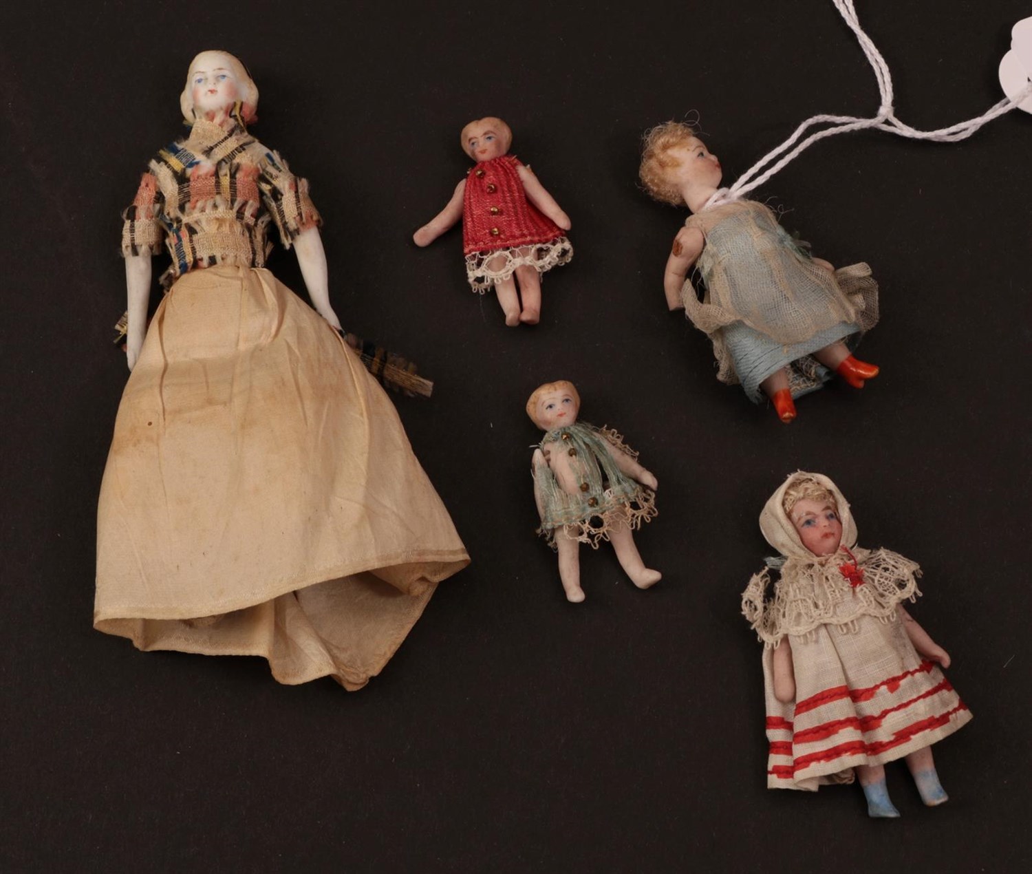 Lot 6009 - Late 19th/Early 20th Century Bisque Miniature Dolls House Figures, comprising a doll with...