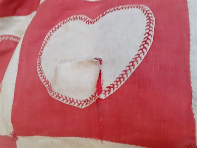 Lot 6019 - A 19th Century Wedding Patchwork Cover, of turkey red and white  hearts, edged with feather...