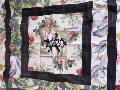 Lot 6021 - Circa 1940s Patchwork, worked in black frames with a central diamond medallion incorporating floral