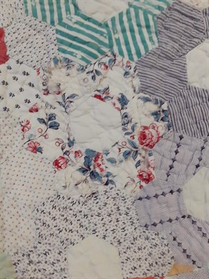 Lot 6028 - Late 19th Century Country Patchwork Quilt, with hexagonal coloured cotton flower head patches...