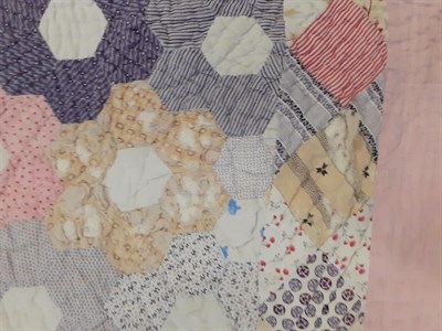 Lot 6028 - Late 19th Century Country Patchwork Quilt, with hexagonal coloured cotton flower head patches...