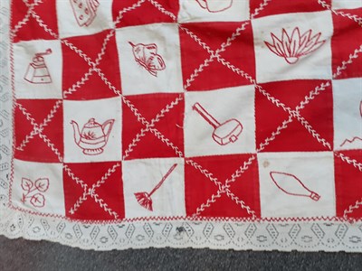 Lot 6038 - Early 20th Century Embroidered Cot Cover, worked in squares of cotton and embroidered in red...