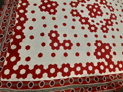 Lot 6040 - Late 19th Century Red and White Hexagonal Patchwork Quilt, within a red, black and white...