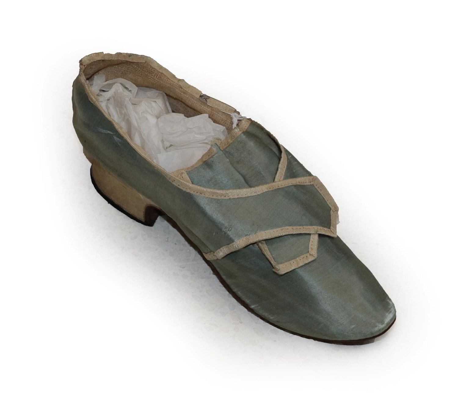 Lot 6065 - A Mid 18th Century Pale Blue Silk Single Shoe, with natural linen lining, cream silk trim and...