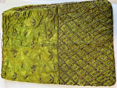 Lot 6066 - An 18th Century Green Figured Silk Reticule, woven with silver threads in a trellis design to...