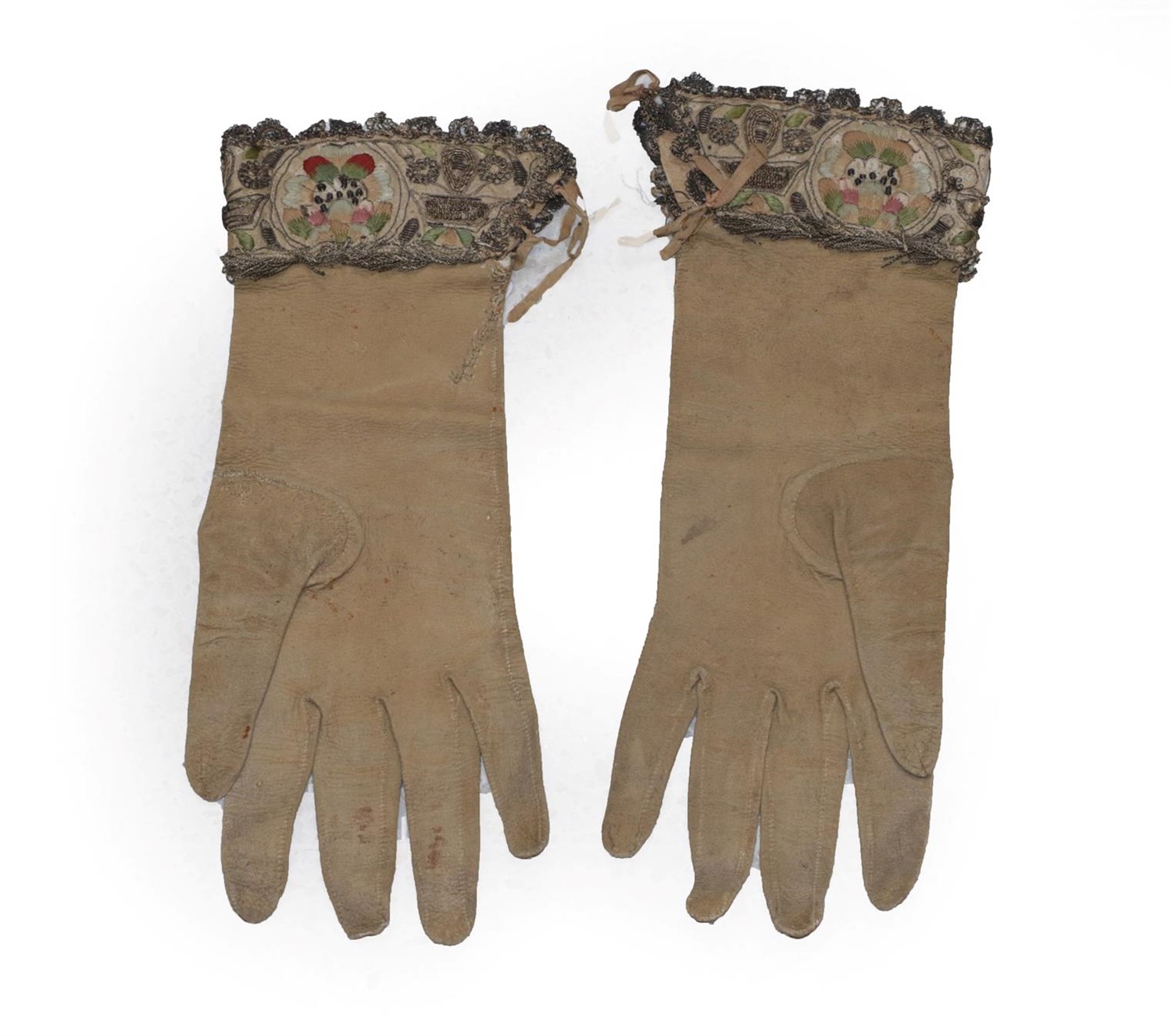 Lot 6070 - Pair of 17th Century Leather Gauntlets, with floral embroidery and silver work trims, silk and...