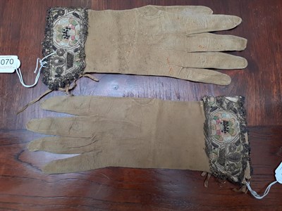 Lot 6070 - Pair of 17th Century Leather Gauntlets, with floral embroidery and silver work trims, silk and...