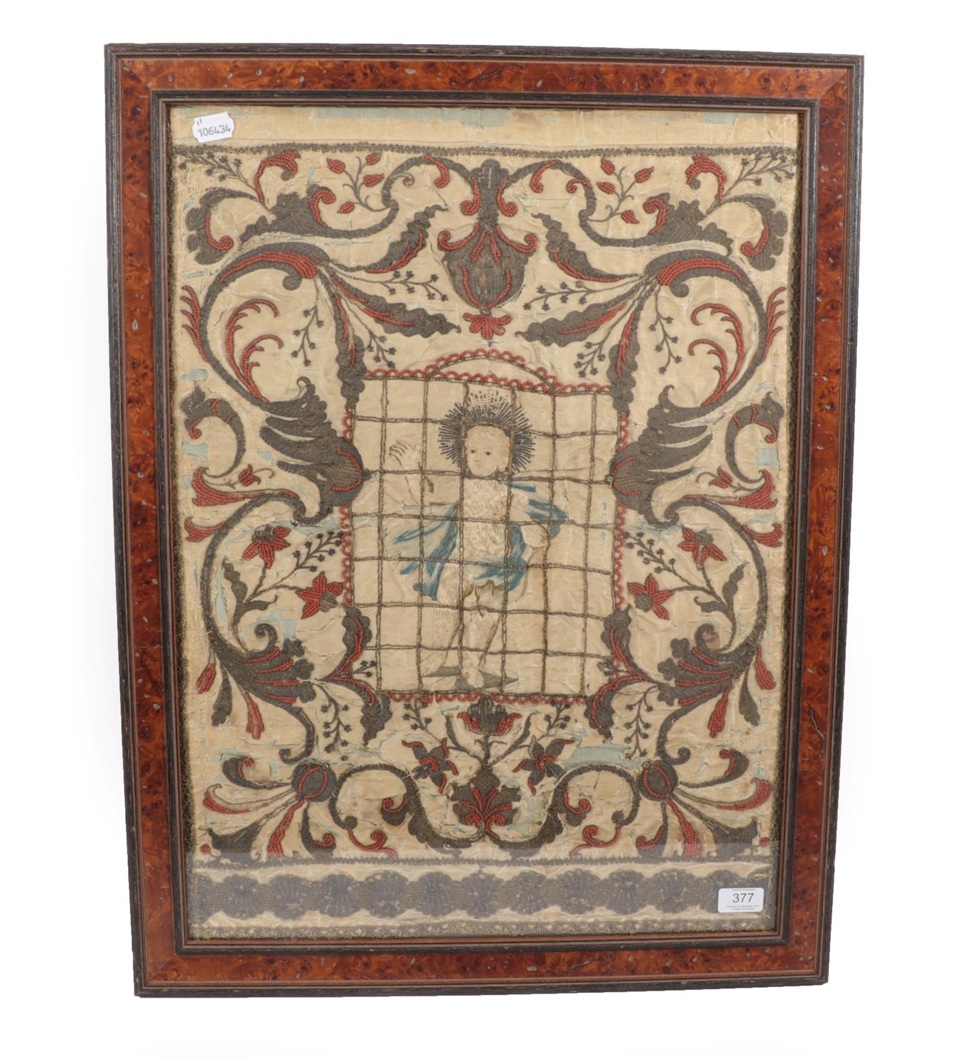 Lot 6109 - A 17th Century Silkwork Panel worked in coloured thread and coral beads with the young Christ...