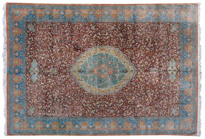 Lot 1259 - An Extremely Fine Ghom Silk Carpet  Central Persia The rust coloured field of scrolling leafy vines