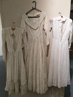 Lot 6127 - Early 20th Century Wedding Dresses, comprising a Gordon Gowns white lace mounted long sleeved dress