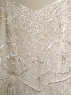 Lot 6127 - Early 20th Century Wedding Dresses, comprising a Gordon Gowns white lace mounted long sleeved dress