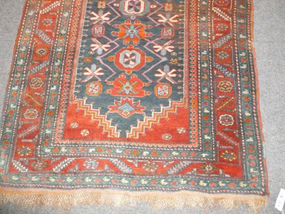 Lot 1264 - Caucasian Wool Runner The indigo field with a continuous row of octagon motifs within stepped...