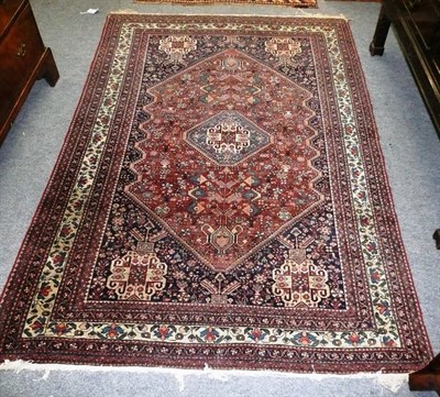 Lot 1266 - Abadeh Rug South West Persia The lozenge shaped field richly covered with tribal motifs around...