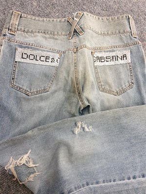 Lot 6206 - Dolce and Gabbana Clothing comprising a  Vintage Distressed Denim Corset Jacket with long...