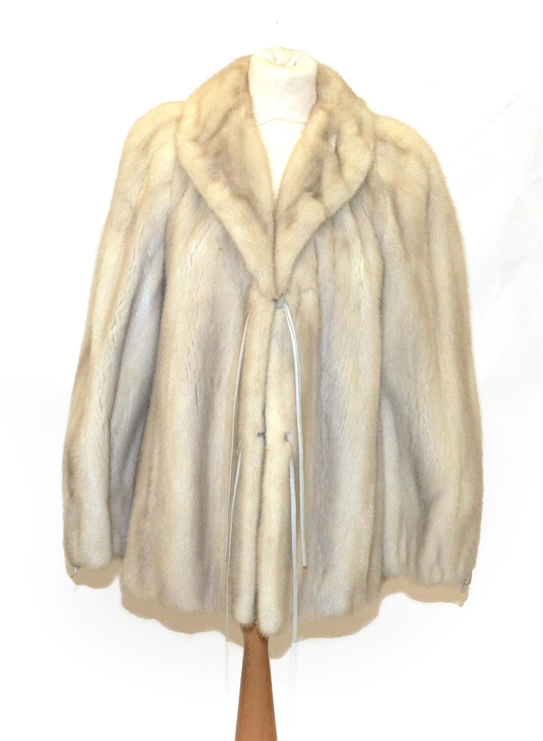 Lot 6216 - A Bradleys Creamy Grey Mink Fur Jacket, with slit pockets and dove grey leather ties to cuffs...
