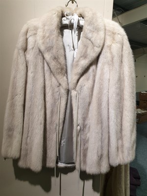 Lot 6216 - A Bradleys Creamy Grey Mink Fur Jacket, with slit pockets and dove grey leather ties to cuffs...