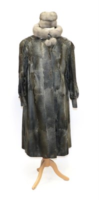 Lot 6227 - Silver Grey Shaved Astrakan Coat, with Nehru collar, long sleeves and cuffs (size 10-14);...