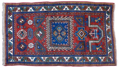 Lot 1271 - Armenian Kazak Prayer Rug Central Caucasus  The madder field of geometric devices beneath the...