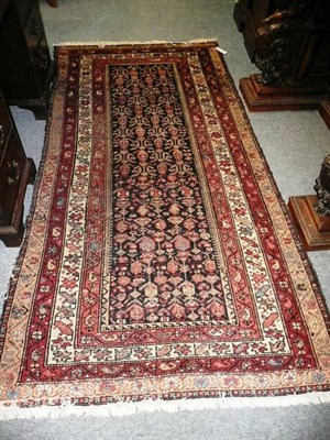 Lot 1273 - Malayir Rug  West Persia The midnight blue field with rows of boteh enclosed by triple narrow...