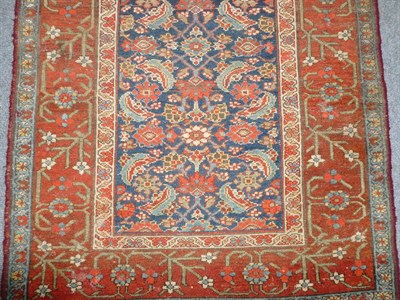 Lot 1277 - Feraghan Runner  West Persia The deep indigo Herati field enclosed by abrashed borders of...