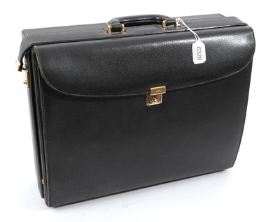 Lot 6320 - Gucci Black Leather Briefcase, comprising a hard case compartment to one side and soft leather...