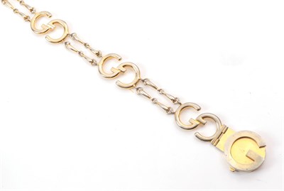 Lot 6321 - Circa 1980s Gucci Gilt Metal Chain Belt, incorporating seven 'GG' logos interlinked by a double...