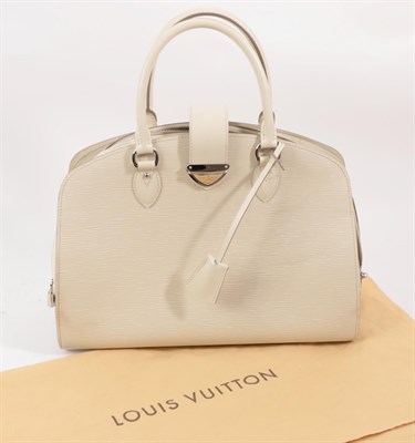Lot 6331 - A Louis Vuitton Cream Epi Leather Handbag, with rounded corners to the top, two carrying...