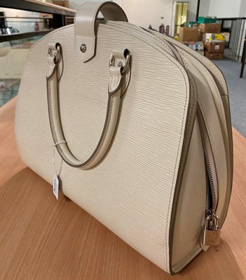 Lot 6331 - A Louis Vuitton Cream Epi Leather Handbag, with rounded corners to the top, two carrying...