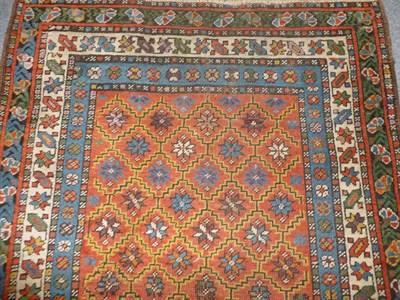 Lot 1280 - South Caucasian Runner The stepped terracotta lattice field of stellar motifs enclosed by...