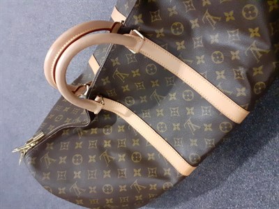 Lot 6341 - Louis Vuitton 55 Keepall Monogrammed Travel Bag, with zip fastening, leather straps and...