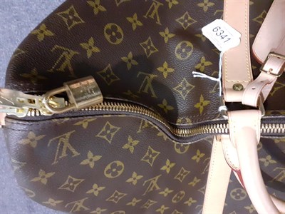 Lot 6341 - Louis Vuitton 55 Keepall Monogrammed Travel Bag, with zip fastening, leather straps and...