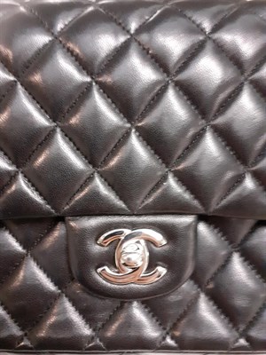 Lot 6349 - Chanel Black Leather Quilted Double Flap Handbag, with chrome fittings, burgundy leather...