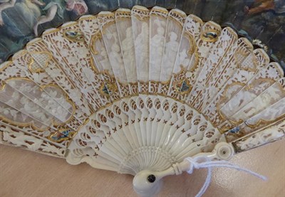 Lot 5037 - A Fine Late 18th Century Ivory Fan with painted leaf, the monture elaborately carved. The...