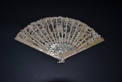 Lot 5041 - A Pretty, Turn of the Century Fan, with an unusually shaded mother-of-pearl monture, quite autumnal