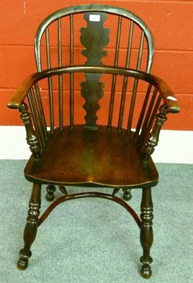 Lot 1286 - A Mid 19th Century Yewwood Windsor Armchair, the double row back support with shaped splat...