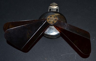 Lot 5051 - A White Metal Mechanical Fan, with tortoiseshell blades, a central brass metal ring stamped...