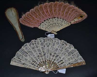 Lot 5055 - A Circa 1920's Pink Mother-of-Pearl Fan, the monture gilded, mounted with a Brussels tape lace...