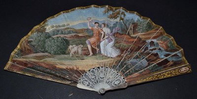 Lot 5069 - A Regency Ivory Fan with tiny gorge and barrel head. The guards are applied with white metal,...