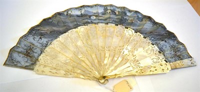 Lot 5078 - A Mid-19th Century Fan with deep and heavy mother-of-pearl monture, intricately carved and pierced